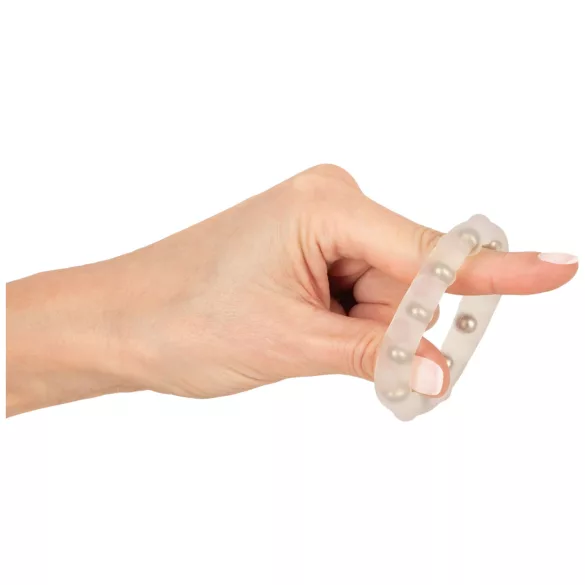 Rebel - anneau pénien en silicone transparent à billes métalliques et à picots.